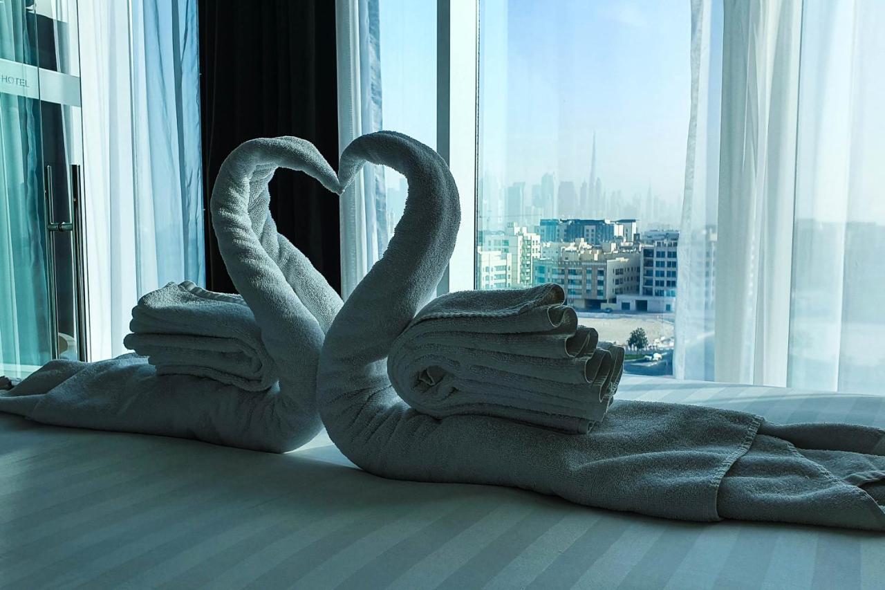The Canvas Dubai - Mgallery Hotel Collection Kültér fotó Towel swans